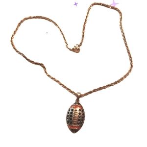 Pave crystal silvertoned football necklace blue & orange